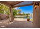 Covered patio offers serene views of the pond at 20740 N 62Nd Ave, Glendale, AZ 85308