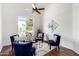 Cozy sitting area boasts high ceilings, ceiling fan, and backyard water views at 20740 N 62Nd Ave, Glendale, AZ 85308