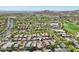 A home pinpoints the location within a lovely, well-maintained neighborhood surrounded by a golf course and desert landscape at 21155 W Green St, Buckeye, AZ 85396