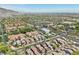Wide aerial view of a neatly planned community with an abundance of trees and green spaces at 21155 W Green St, Buckeye, AZ 85396