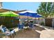 Backyard with patio furniture, grill, and lush landscaping for a private outdoor retreat at 21155 W Green St, Buckeye, AZ 85396
