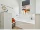 Bathroom featuring a soaking tub, window with a view, and cabinet storage at 21155 W Green St, Buckeye, AZ 85396