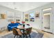 Bright dining area with modern furniture, plenty of sunlight, and backyard access at 21155 W Green St, Buckeye, AZ 85396