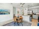 Open-concept kitchen and dining area with stainless steel appliances and comfortable seating at 21155 W Green St, Buckeye, AZ 85396