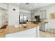 Bright kitchen features granite countertops, stainless steel appliances, and a large island with a sink at 21155 W Green St, Buckeye, AZ 85396