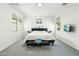 Spacious main bedroom with a king bed, bench, and many windows providing natural light at 21155 W Green St, Buckeye, AZ 85396