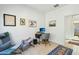 Home office featuring a desk and chair, an area rug, and many framed prints at 21155 W Green St, Buckeye, AZ 85396