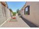 Side yard with gravel landscaping, privacy fence, and a cozy area at 21155 W Green St, Buckeye, AZ 85396