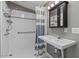 Updated bathroom featuring a walk-in shower, modern vanity, and stylish fixtures at 2121 N Center St # 166, Mesa, AZ 85201