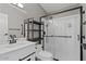 Updated bathroom with walk-in shower, modern fixtures, and shelving at 2121 N Center St # 166, Mesa, AZ 85201