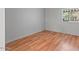 Bright bedroom features hardwood flooring and a window with natural light at 2121 N Center St # 166, Mesa, AZ 85201