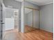 This bedroom features modern paint and large mirrored closet doors at 2121 N Center St # 166, Mesa, AZ 85201