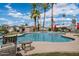 Enjoy a refreshing swim in the community pool with ample seating and well-manicured landscaping at 2121 N Center St # 166, Mesa, AZ 85201