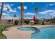 Unwind in the sparkling pool and hot tub, surrounded by palm trees, lush greenery, and comfortable seating at 2121 N Center St # 166, Mesa, AZ 85201