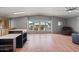 Cozy living room with a window view, plush seating, and stylish ceiling fan at 2121 N Center St # 166, Mesa, AZ 85201