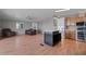 Open living area with kitchen island, seating, and modern appliances at 2121 N Center St # 166, Mesa, AZ 85201