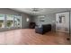 Comfortable living room with light hardwood floors and large windows, offering a relaxing space at 2121 N Center St # 166, Mesa, AZ 85201