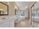 Spacious bathroom with double sinks, soaking tub, and walk-in shower at 2343 E Kempton Rd, Chandler, AZ 85225