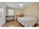 Bedroom with window, dresser, ceiling fan, and wood flooring at 2343 E Kempton Rd, Chandler, AZ 85225