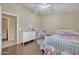 Adorable bedroom with a crib, toy kitchen, and plenty of natural light at 2343 E Kempton Rd, Chandler, AZ 85225