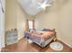 Cozy bedroom with warm tones, wood floors, and a ceiling fan for a comfortable atmosphere at 2343 E Kempton Rd, Chandler, AZ 85225