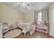 Playful bedroom featuring a crib, toys, and cheerful decor at 2343 E Kempton Rd, Chandler, AZ 85225