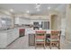 Bright and modern kitchen with stainless steel appliances, a large island, and ample counter space at 2343 E Kempton Rd, Chandler, AZ 85225