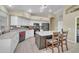 Bright kitchen with white cabinetry, stainless steel appliances, and a functional center island at 2343 E Kempton Rd, Chandler, AZ 85225