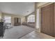 Open living area with vaulted ceiling, light gray sofas, and modern fixtures at 2343 E Kempton Rd, Chandler, AZ 85225