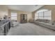 Spacious living area with light gray sofas, shelving, and large windows for natural light at 2343 E Kempton Rd, Chandler, AZ 85225