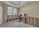 A well-lit office space with large window, multiple seats, and built-in wooden drawers at 2343 E Kempton Rd, Chandler, AZ 85225