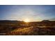 Serene desert landscape basking in the glow of the setting sun, capturing a tranquil and picturesque vista at 24422 N 128Th Way, Scottsdale, AZ 85255