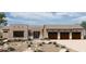 Stunning single-story home boasts a spacious three-car garage and desert landscaping at 24422 N 128Th Way, Scottsdale, AZ 85255