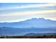 Dramatic view of the distant mountain range with bird soaring in the vast blue sky at 24422 N 128Th Way, Scottsdale, AZ 85255