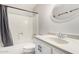 A bathroom with a white vanity, and combination shower and bathtub at 2502 N 22Nd Dr, Phoenix, AZ 85009