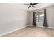 A serene bedroom with light walls, wood floor, and an inviting window at 2502 N 22Nd Dr, Phoenix, AZ 85009