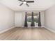 Spacious bedroom with modern fan, neutral colors, and a bright window at 2502 N 22Nd Dr, Phoenix, AZ 85009