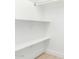 A walk-in closet with white walls and shelves at 2502 N 22Nd Dr, Phoenix, AZ 85009