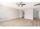 Neutral color living room area with modern ceiling fan and plank flooring at 2502 N 22Nd Dr, Phoenix, AZ 85009