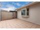 A tiled patio is enclosed by a chain link fence and the exterior of the home at 2502 N 22Nd Dr, Phoenix, AZ 85009