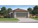 Charming single-Gathering home featuring a tile roof, desert landscaping, and attached two-car garage at 25041 N 174Th Ln, Surprise, AZ 85387