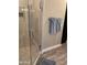 Luxurious frameless glass shower with tiled walls and floor in a modern bathroom at 2511 W Queen Creek Rd # 244, Chandler, AZ 85248