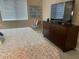 Comfortable bedroom with a plush bed, a TV, and soft natural lighting from the window at 2511 W Queen Creek Rd # 244, Chandler, AZ 85248