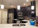 Well-equipped kitchen featuring modern stainless steel appliances, ample counter space, and sleek cabinetry at 2511 W Queen Creek Rd # 244, Chandler, AZ 85248
