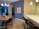 Modern kitchen boasting quartz countertops, a breakfast bar, and a seamless transition to the dining area at 2511 W Queen Creek Rd # 244, Chandler, AZ 85248