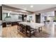 Spacious kitchen and open entertainment area featuring hardwood floors and stainless appliances at 2511 W Queen Creek Rd # 244, Chandler, AZ 85248