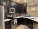 Modern kitchen featuring stainless steel appliances, ample counter space, and stylish backsplash at 2511 W Queen Creek Rd # 244, Chandler, AZ 85248