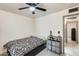 Spare bedroom with ceiling fan, bed, and laundry rack at 2609 N Pleasant Dr, Chandler, AZ 85225