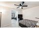 Bedroom featuring a ceiling fan and doorway leading to exercise equipment at 2609 N Pleasant Dr, Chandler, AZ 85225
