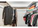 Walk-in closet with wooden rods and shelves for organization at 2609 N Pleasant Dr, Chandler, AZ 85225
